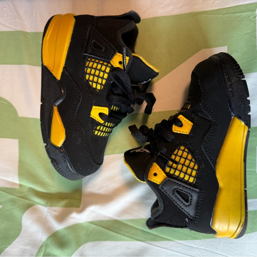 Kids Black and Yellow Sneakers Jordan 4